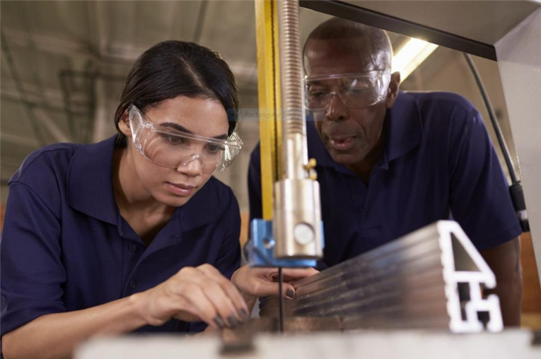 Apprentice cutting metal 